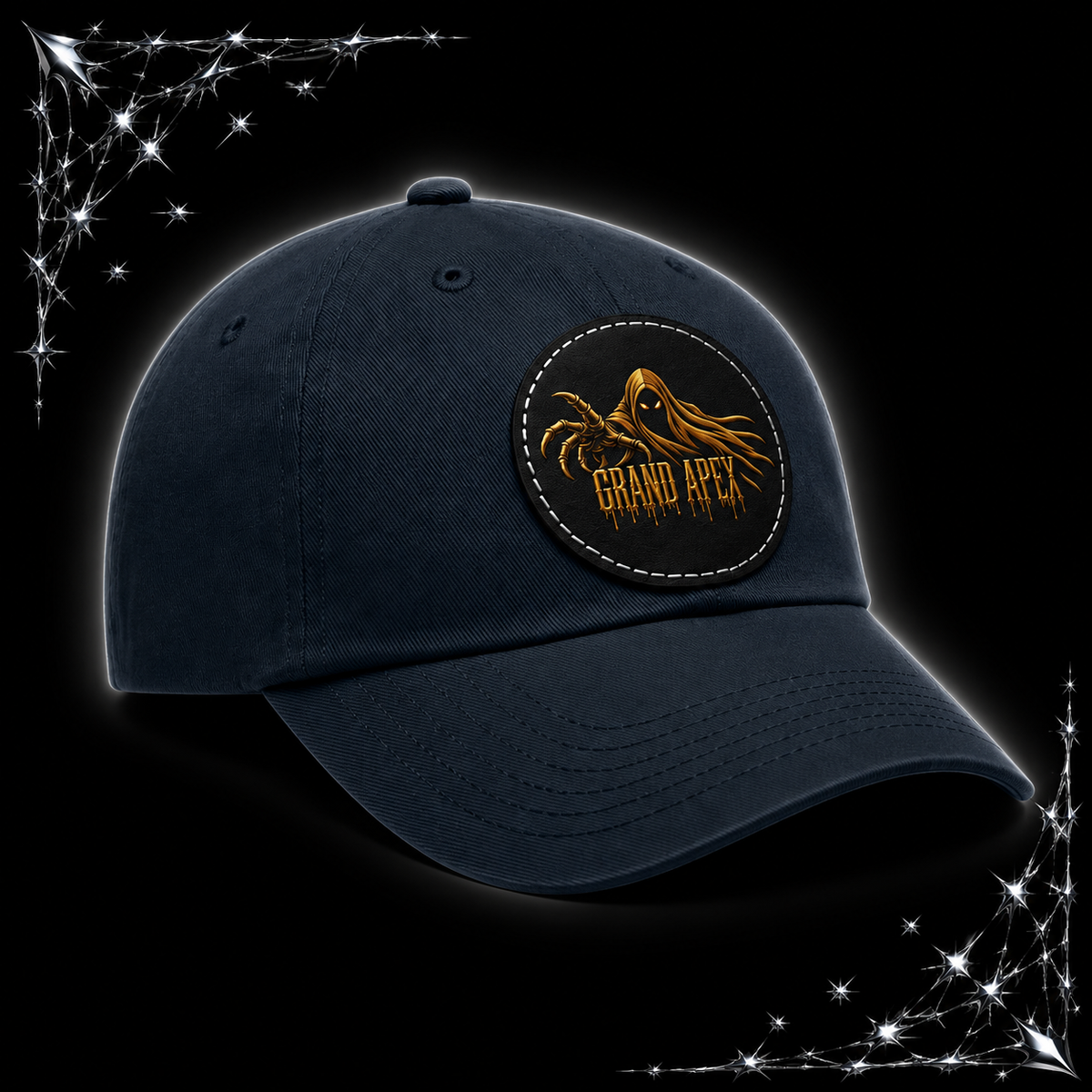 A dark navy blue baseball cap with a circular embroidered patch on the front featuring a golden tentacle graphic and the text 'GRAND APE'. The cap is set against a black background with chrome webbing in the corners.
