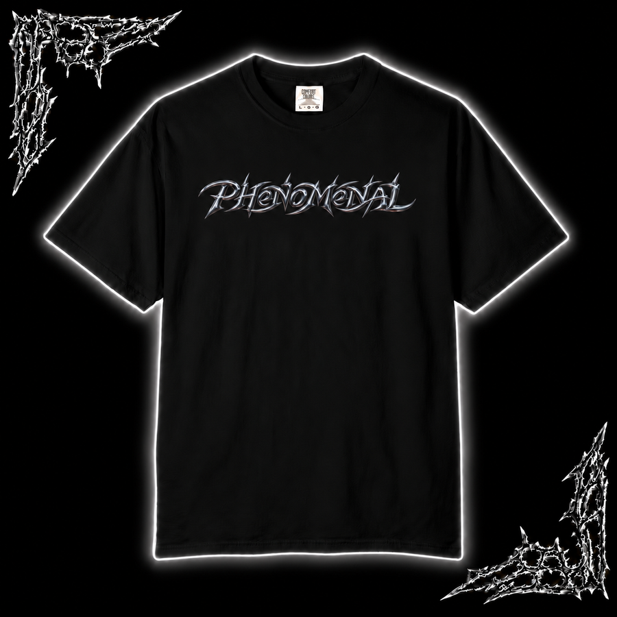 A black short-sleeve t-shirt with the word 'PHENOMENAL' printed across the chest in a stylized white font, presented on a black background with white glowing borders and white graphic elements in the corners.
